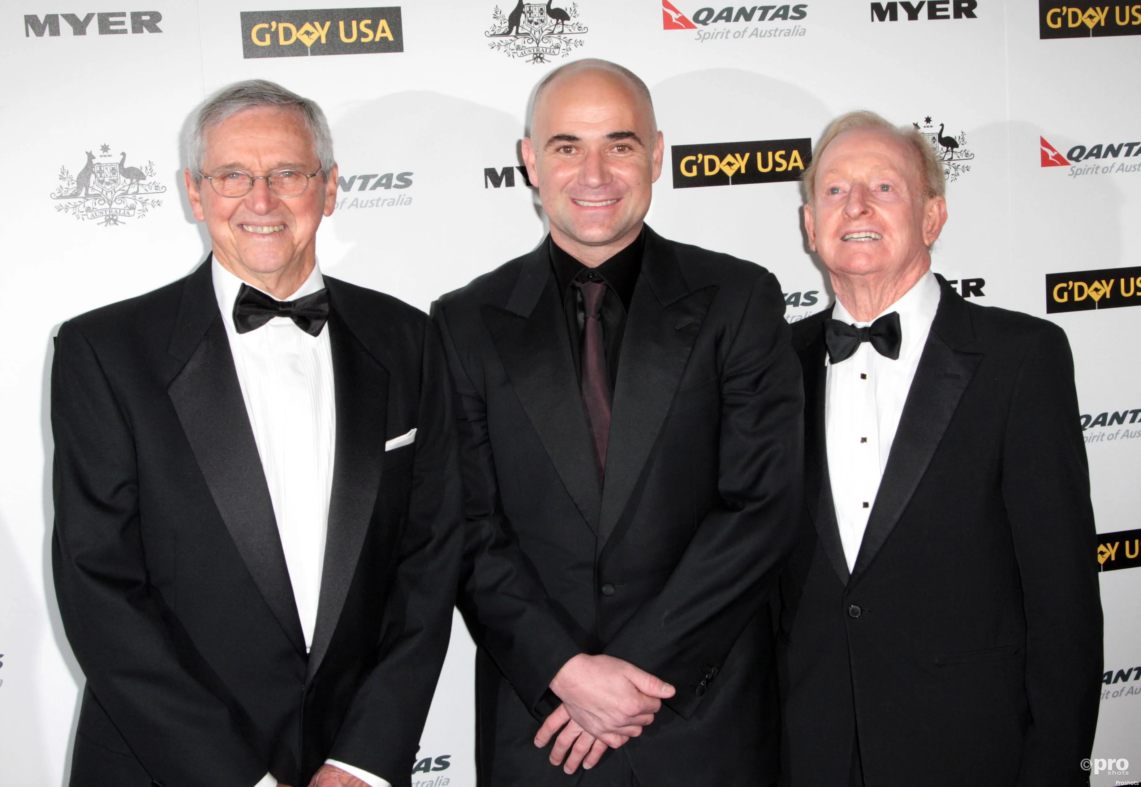 Roy Emerson stands with Agassi and Laver.