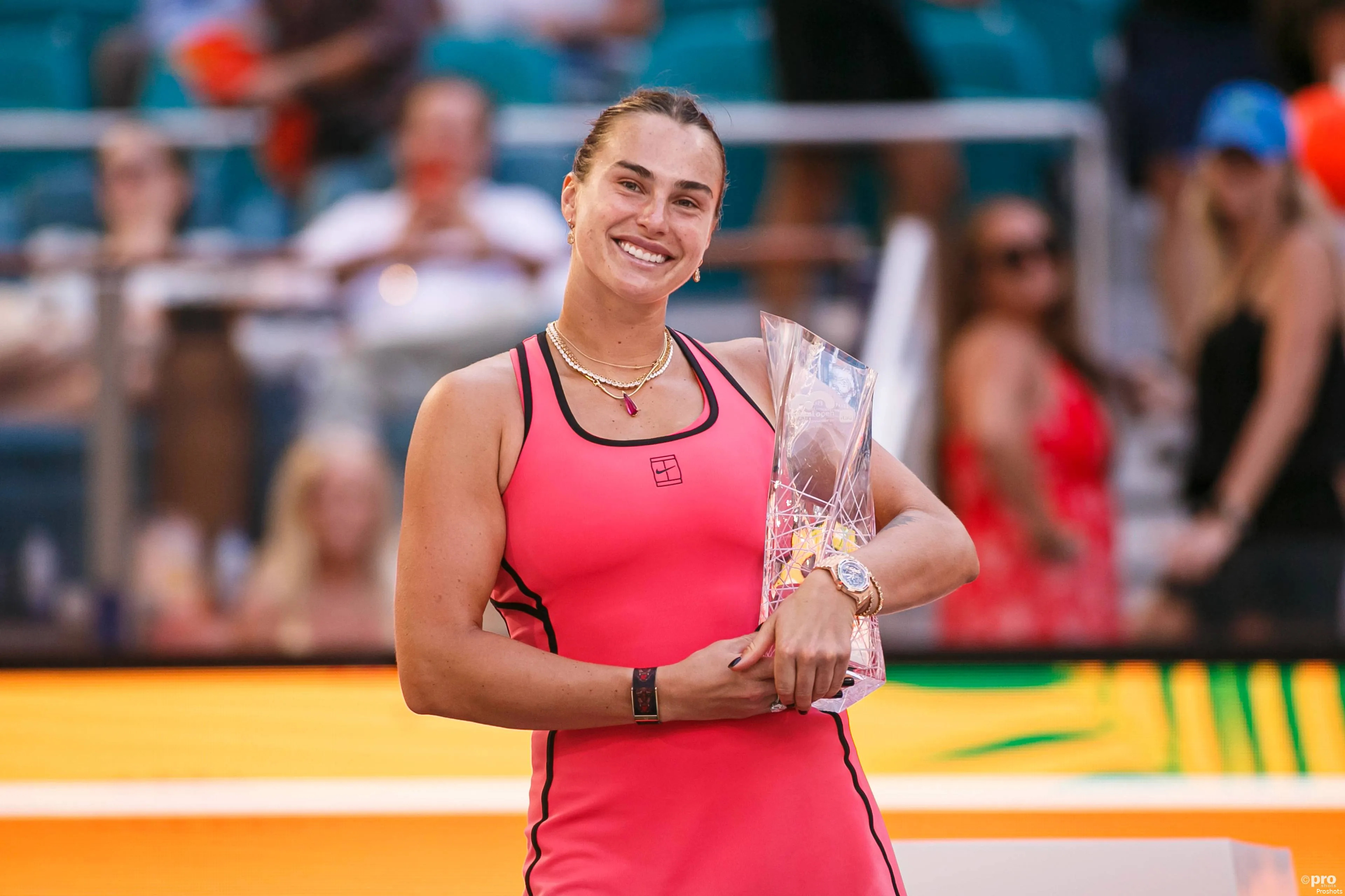 Sabalenka poses for trophy shots.