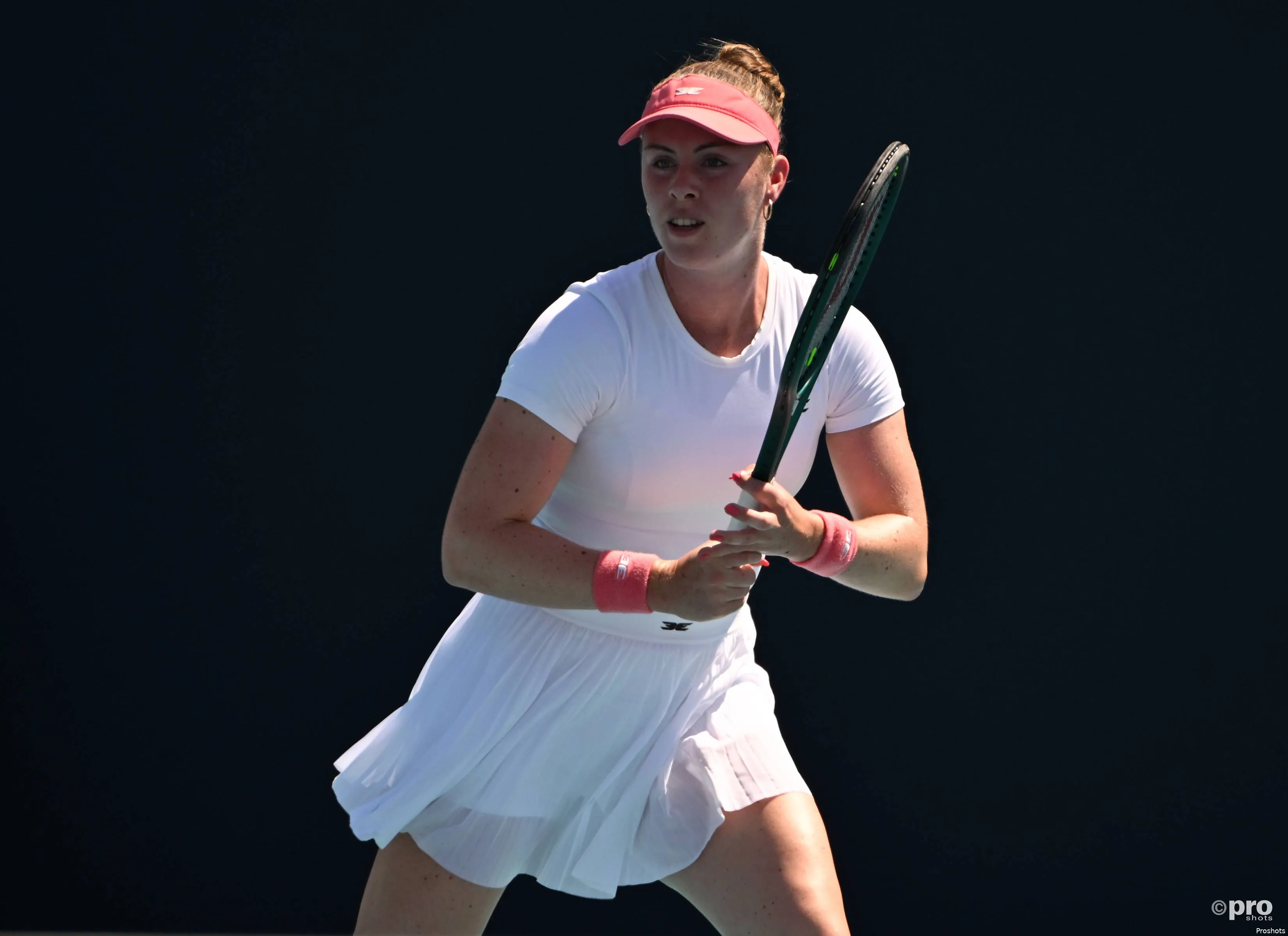 Talia Gibson readies racquet.