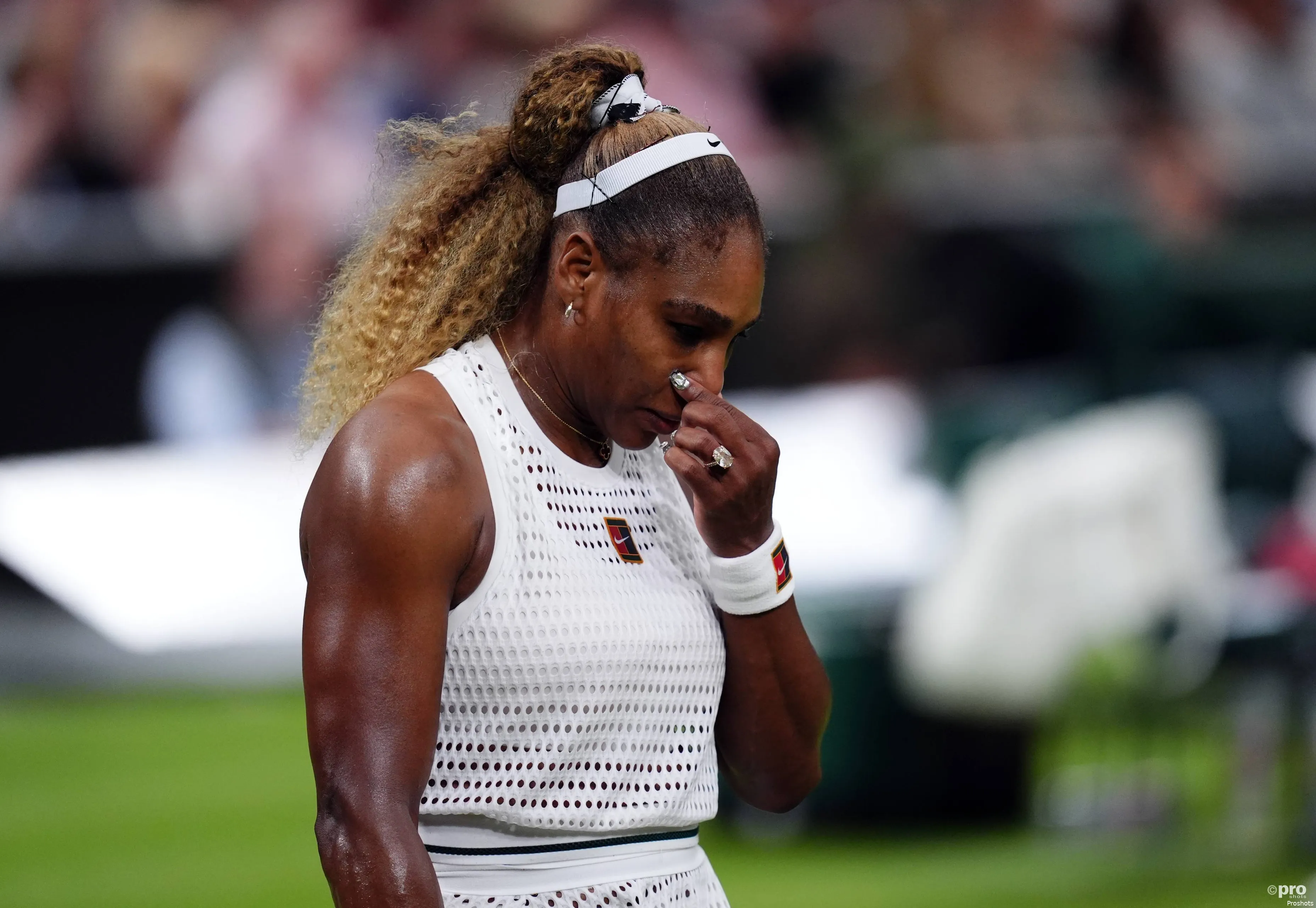 Serena holds nose.