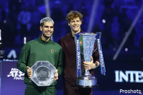Jannik Sinner proudly holds the ATP Finals trophy alongside Carlos Alcaraz in 2025