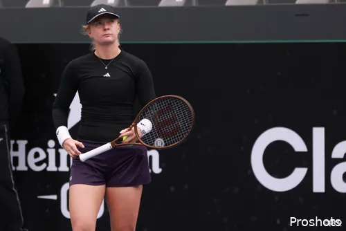 Francesca Jones has racquet in hand.