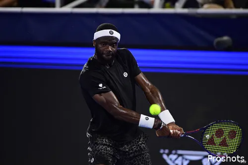 Frances Tiafoe returns on the run.