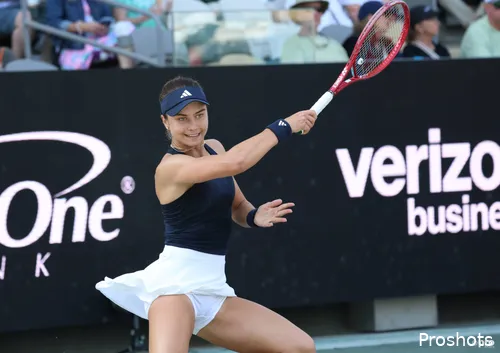 Jovic at full stretch on court.