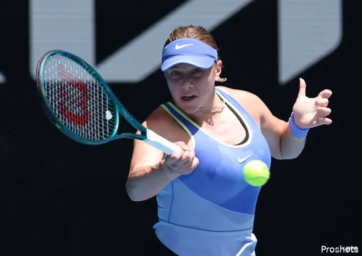 Amanda Anisimova returns at Australian Open.