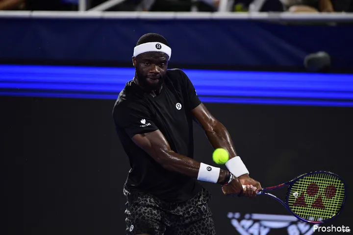 Frances Tiafoe returns on the run.