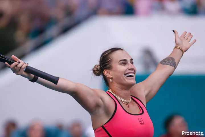 Sabalenka holds arms aloft.