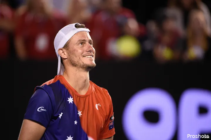 Lleyton Hewitt looks on with a smile.