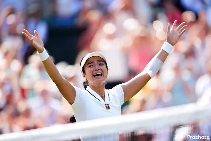 Eala holds arms aloft after win.
