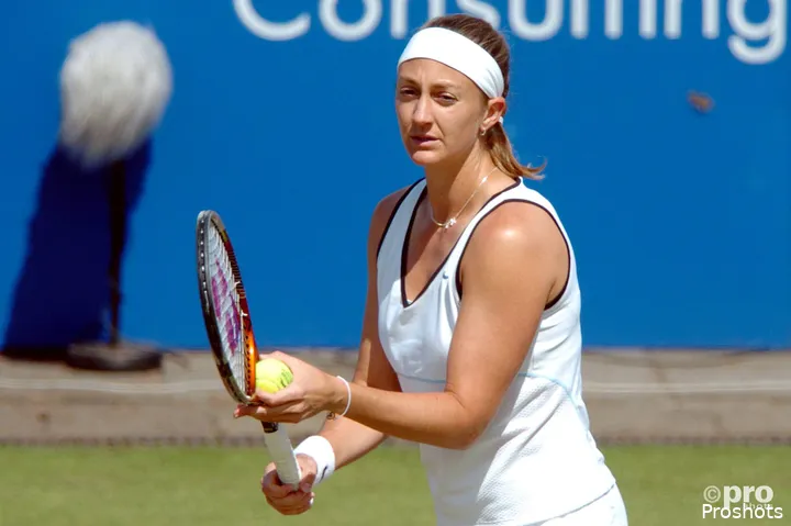 Mary Pierce holds racquet.