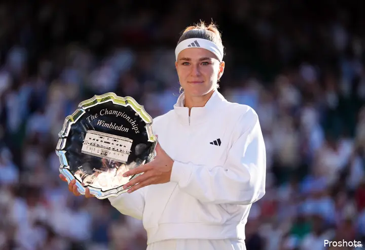 Muchova holds Wimbledon trophy.