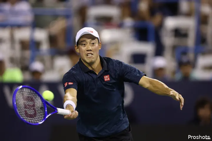 Kei Nishikori reaching for the tennis ball