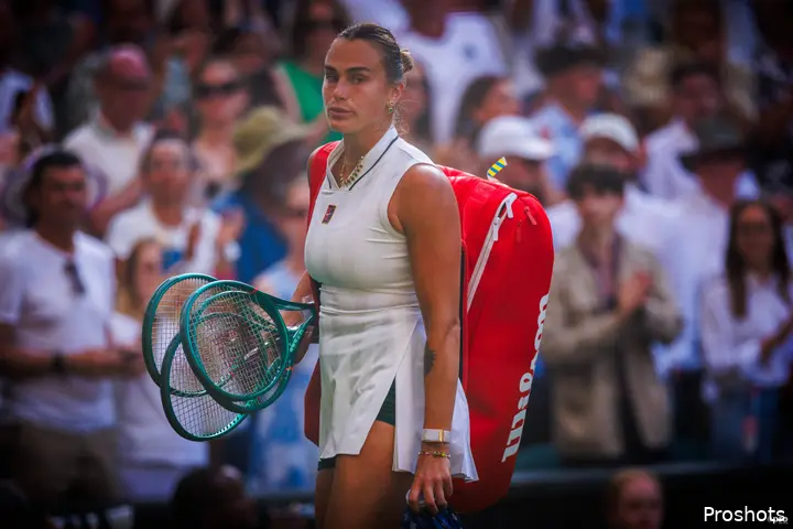 Aryna Sabalenka leaves court after defeat.
