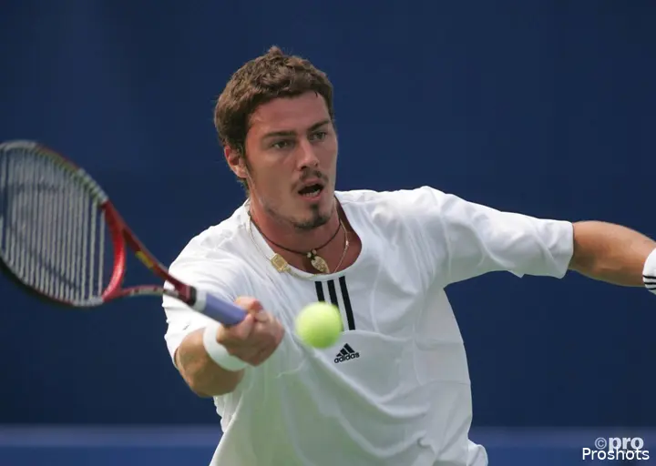 Marat Safin uses a racquet.