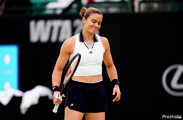 Sakkari looks on.