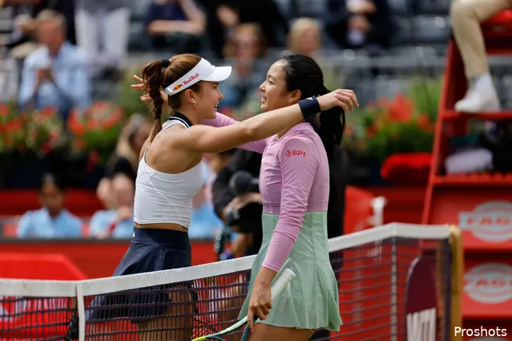 Iva Jovic and Alex Eala embrace at the net after their match at the 2026 Queen's Club Championships.