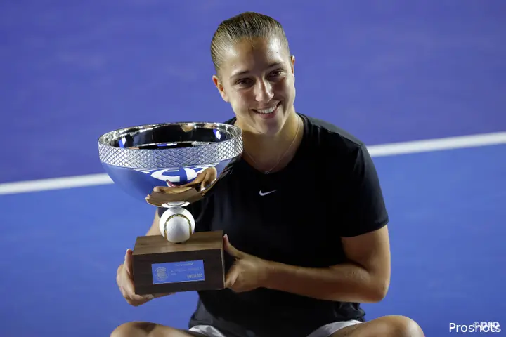 Diane Parry smiling with trophy