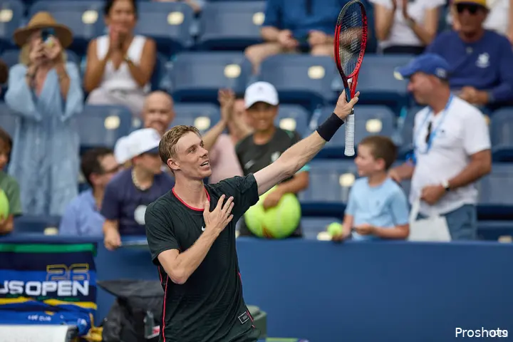 Denis Shapovalov holding his racket up