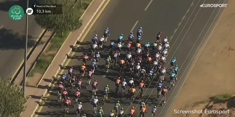 The DSM-Firmenich PostNL team (seen in the middle right of the image) makes a strategic move during the final stage of the AlUla Tour.