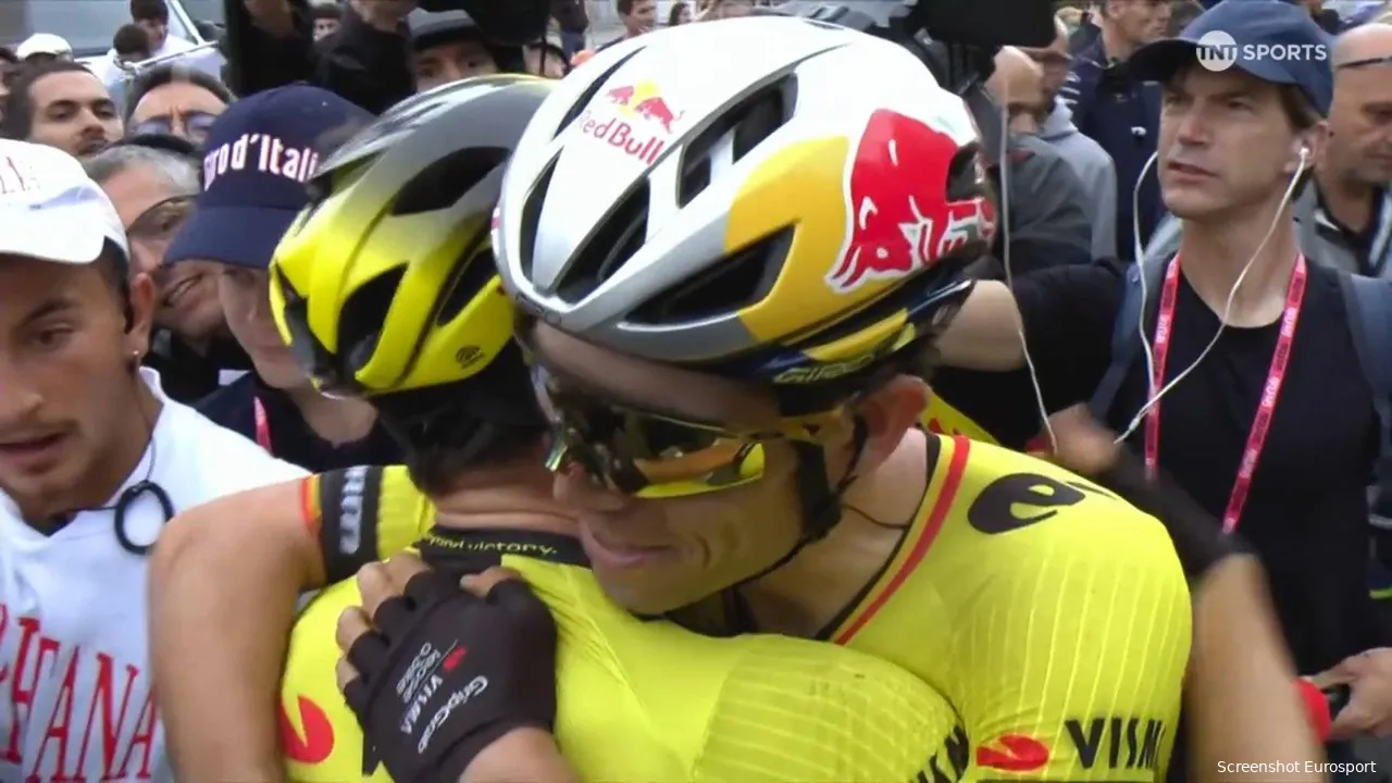 Kooij and Van Aert embraced after the stage win, celebrating a perfectly executed team effort.