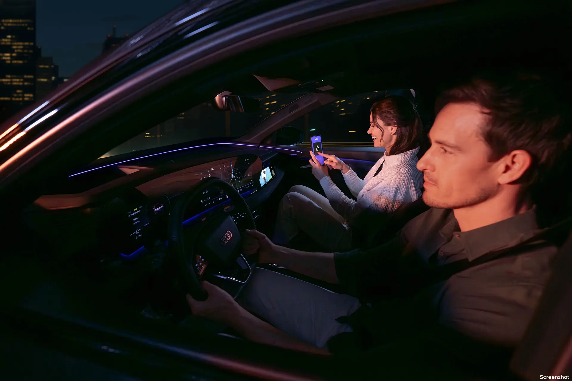 1passenger playing airconsole while vehicle is in motion front seat display experience