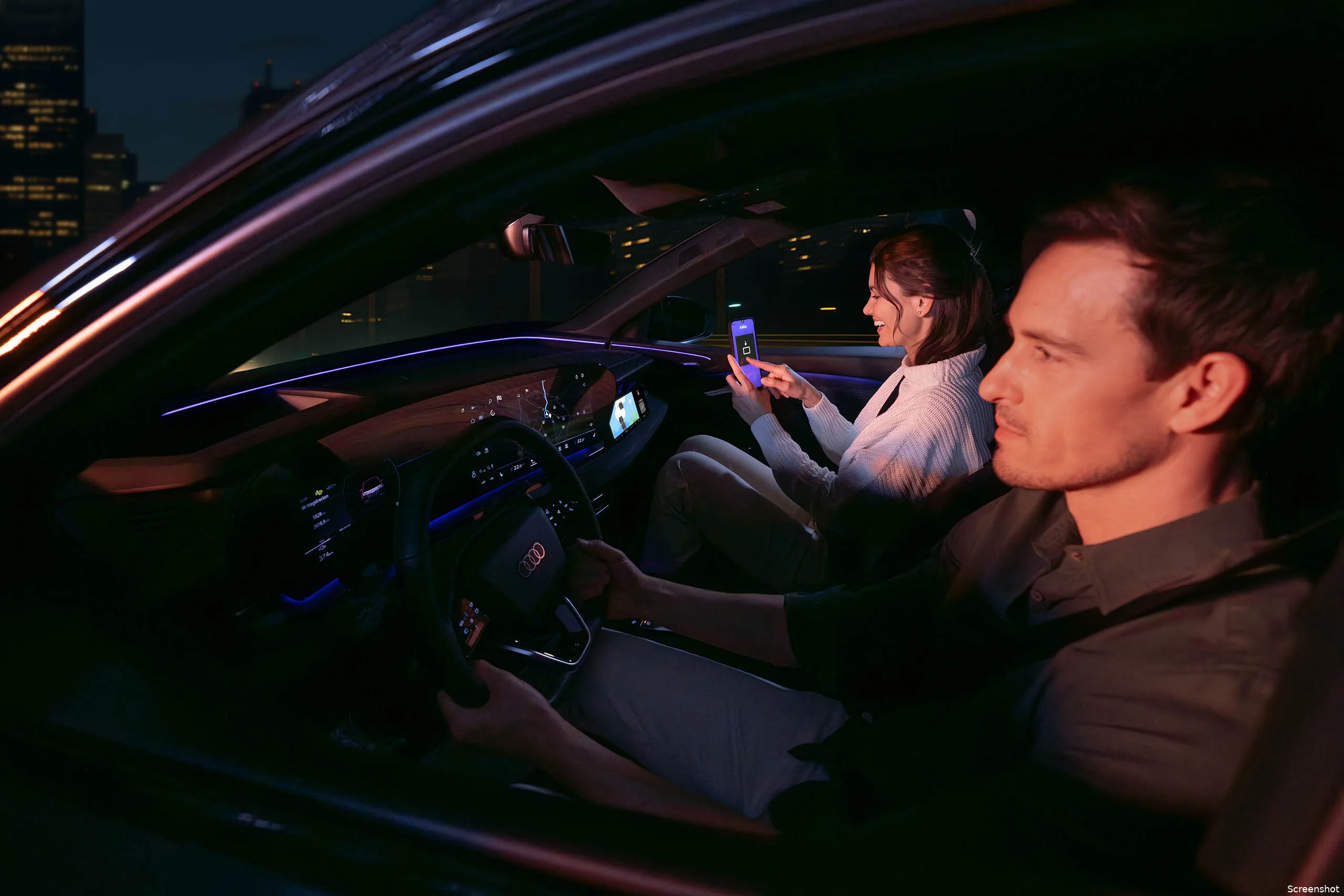 1passenger playing airconsole while vehicle is in motion front seat display experience