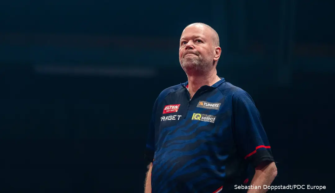 Raymond van Barneveld looks dejected on stage