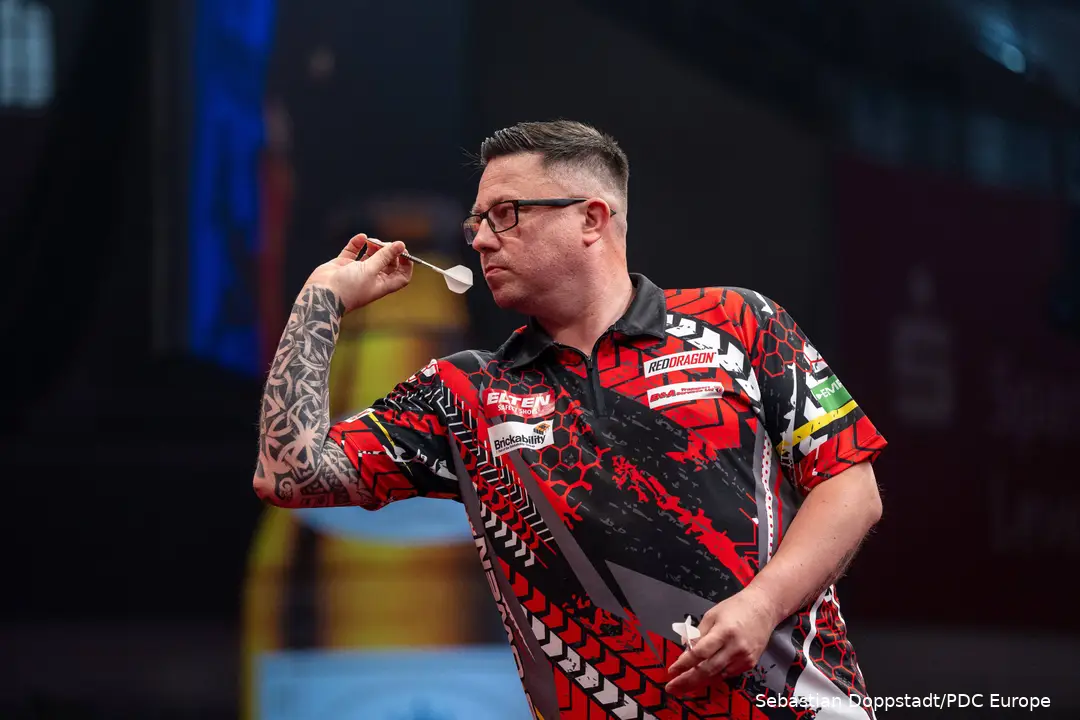 Robert Owen set to throw the dart