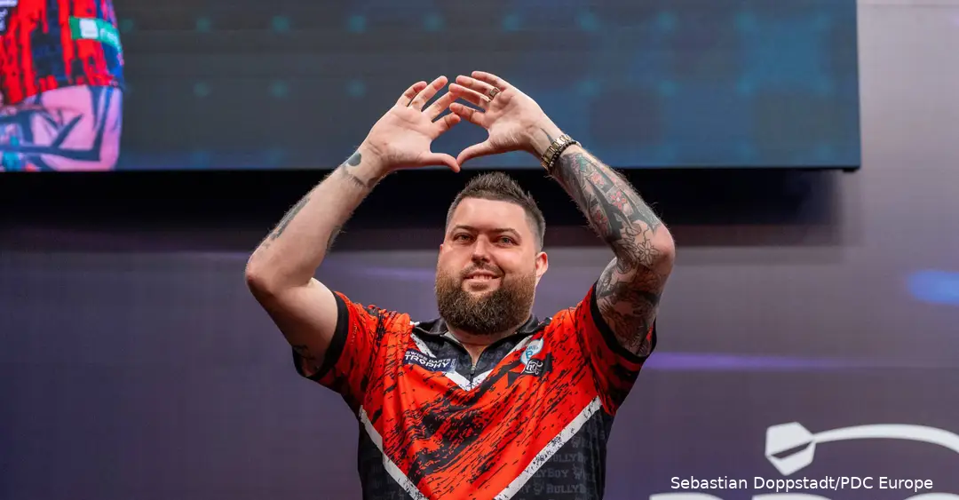 Michael Smith making a heart from his hands