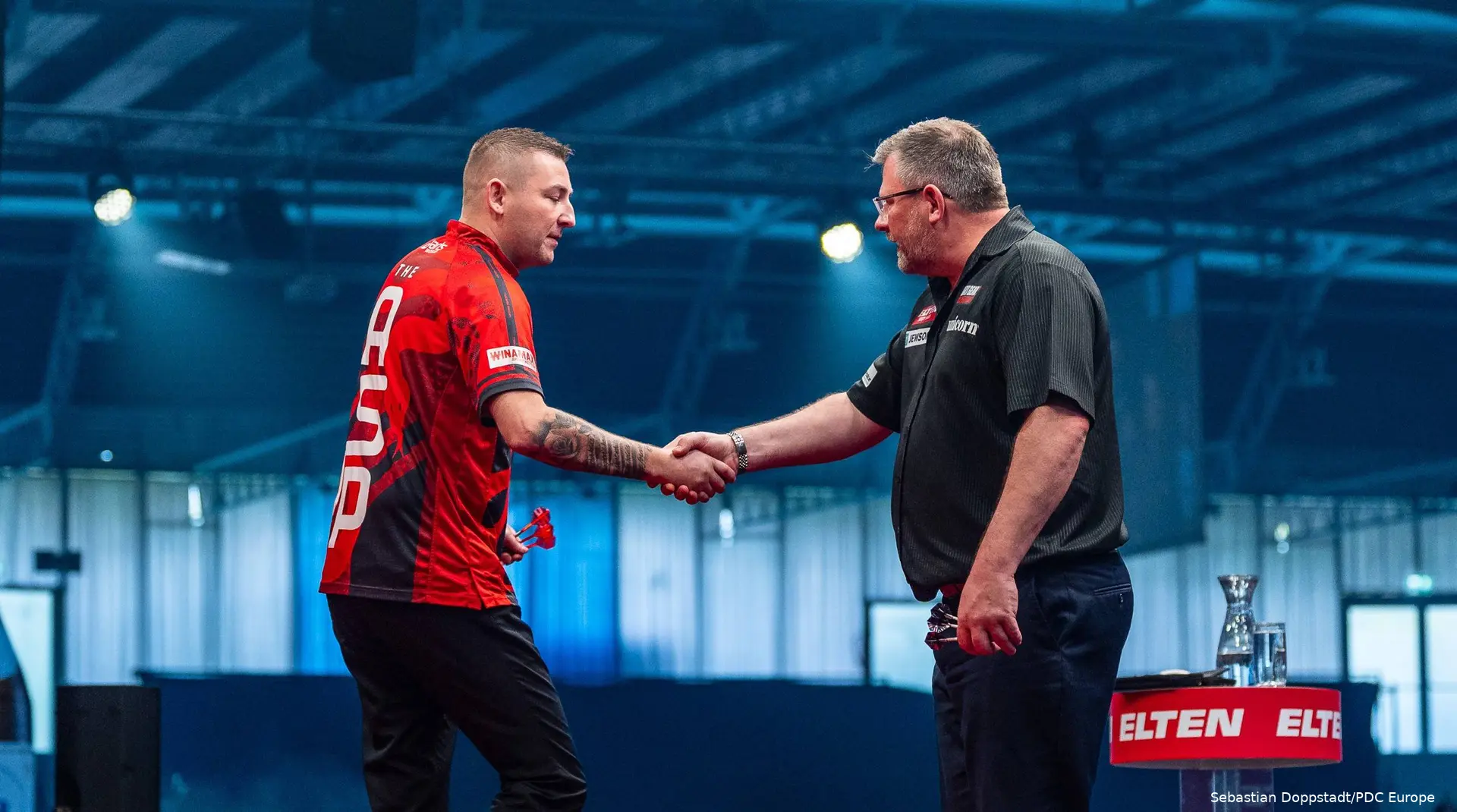 Nathan Aspinall  &amp; James Wade shook hands.
