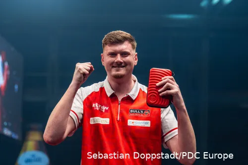 Niko Springer thrusts his fists into the air