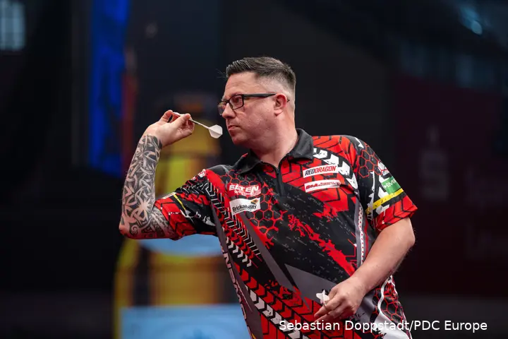 Robert Owen set to throw the dart