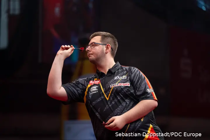 Sebastian Bialecki throws darts.