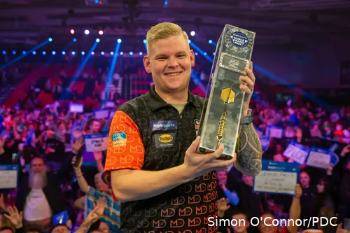 Mike De Decker shows off his World Grand Prix trophy