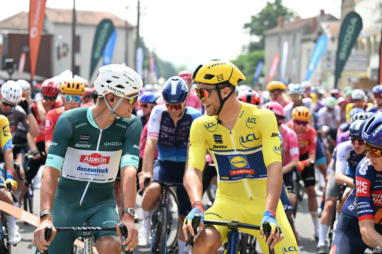 Mathieu van der Poel in the green jersey next to yellow jersey Jonathan Milan.