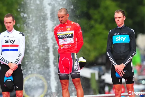 Chris Froome and Bradley Wiggins flank Juan José Cobo on the final podium of the 2011 Tour of Spain