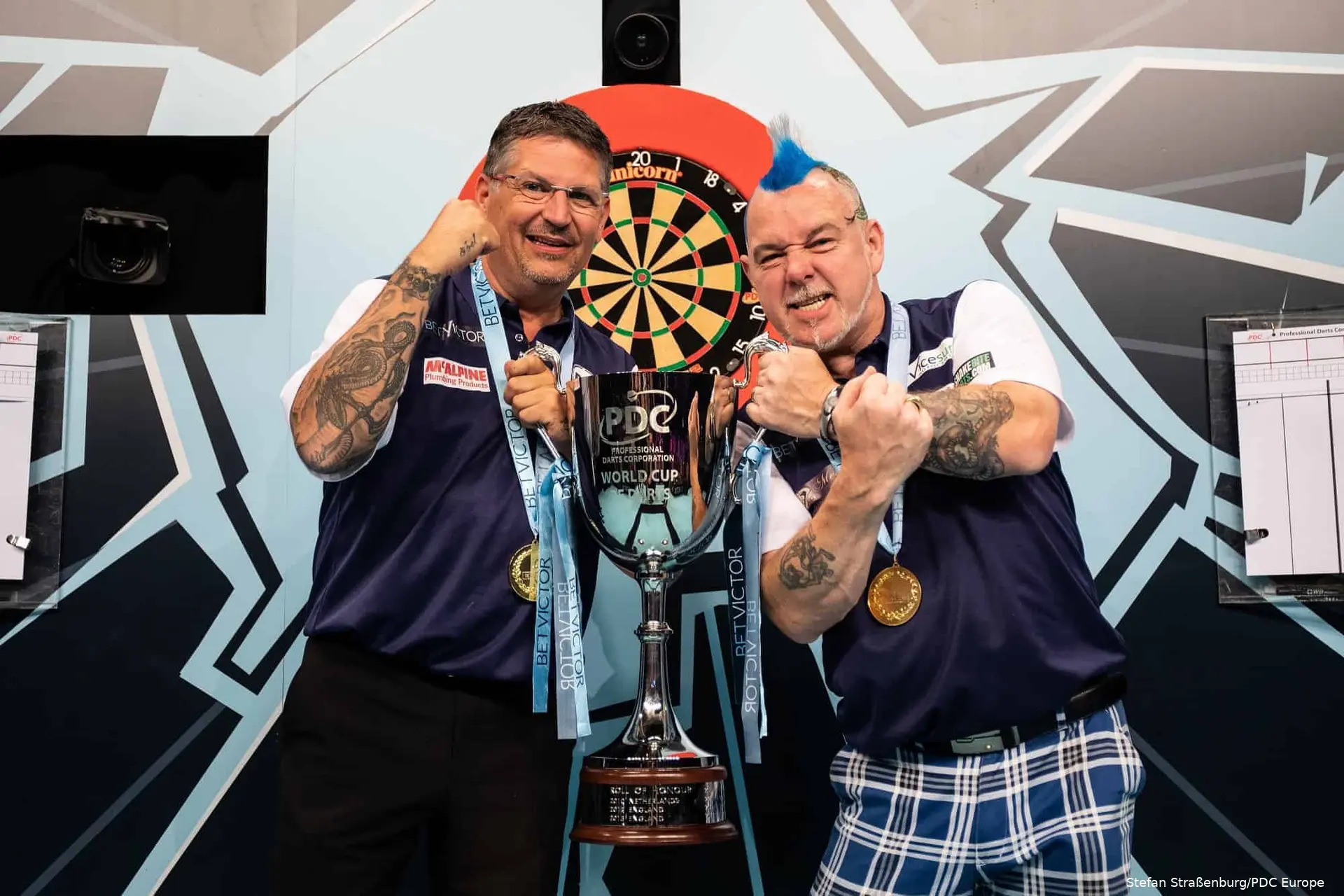 Gary Anderson and Peter Wright celebrate winning the World Cup for Scotland
