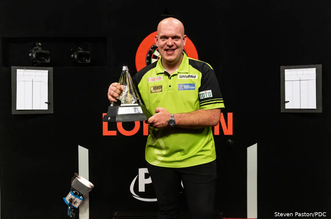 Michael van Gerwen holds the Premier League trophy
