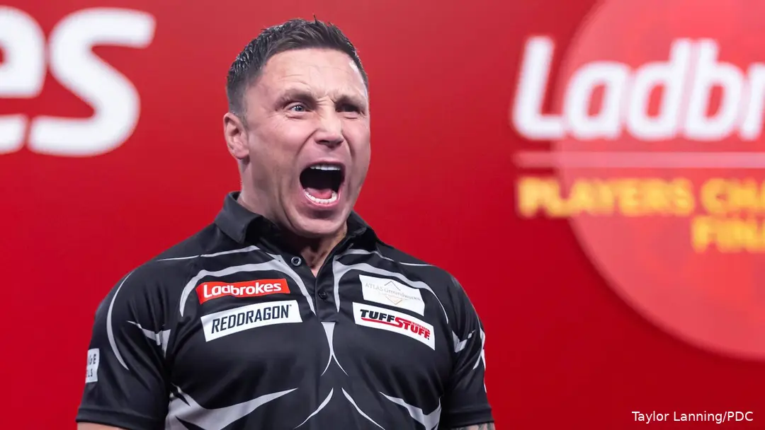 Gerwyn Price with mouth open celebrates in Minehead.