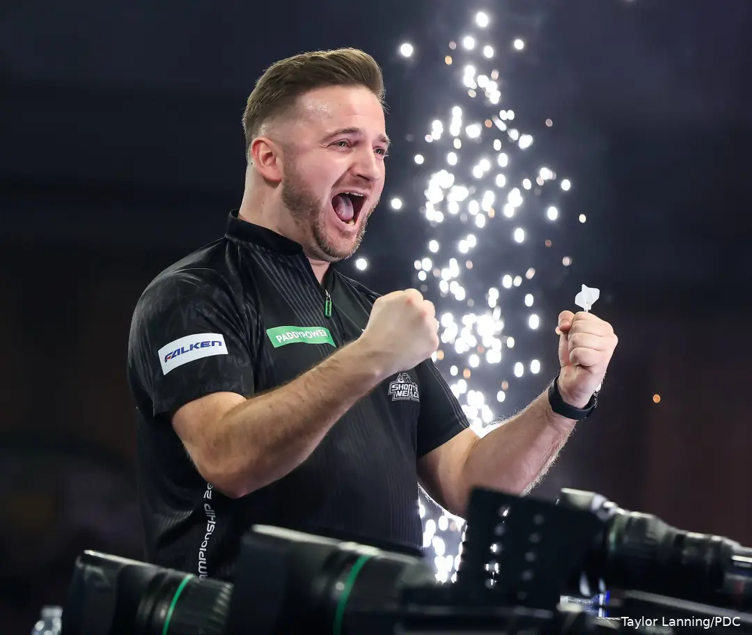 Arno Merk clenches fists celebrating in front of pyro.