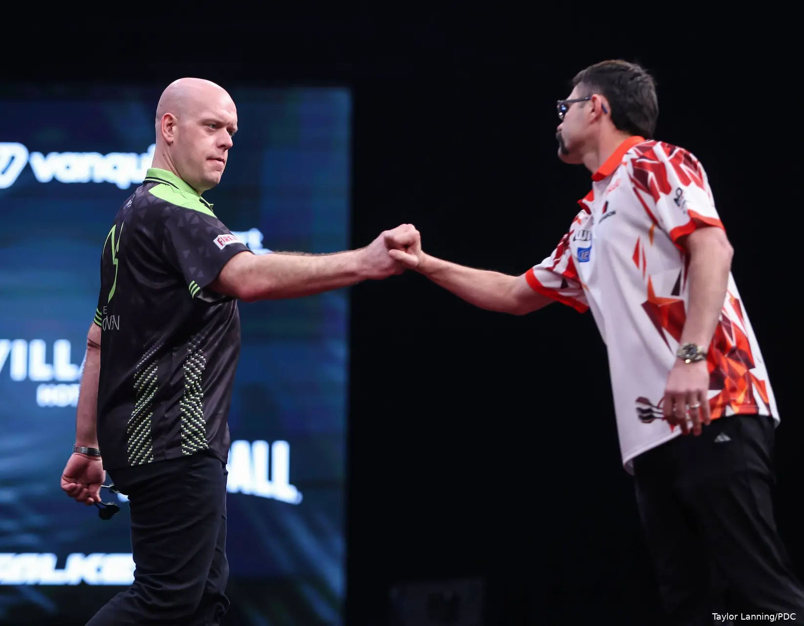 Michael van Gerwen and Damon Heta fistbump before their 2026 Winmau World Masters clash
