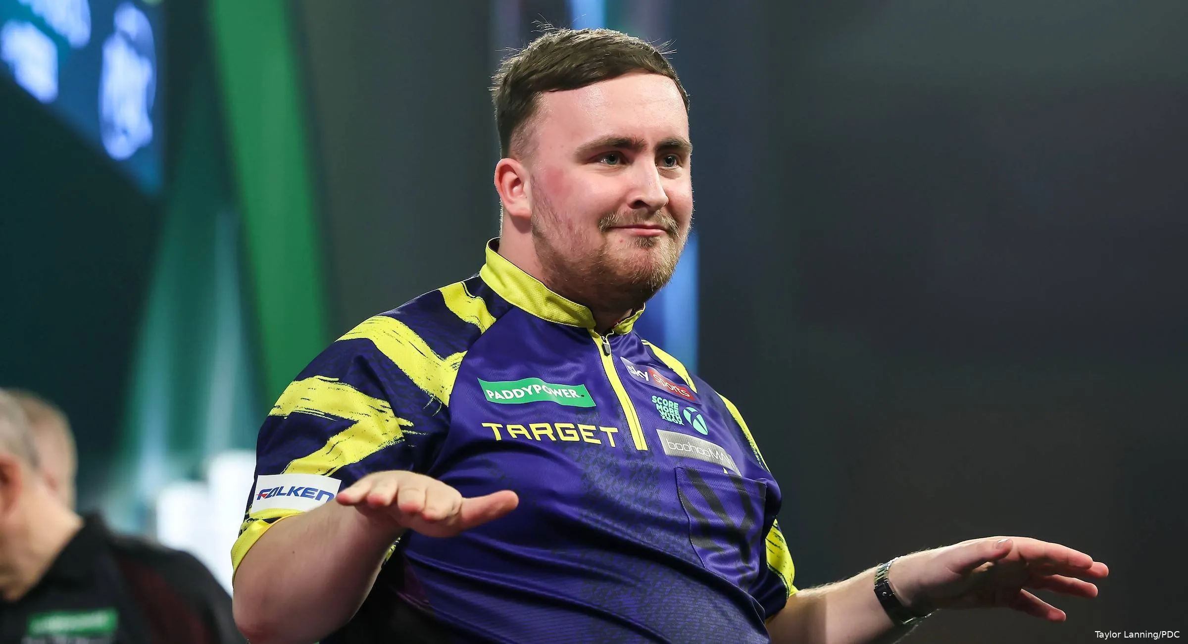 Luke Littler does a dance on stage at the Ally Pally.