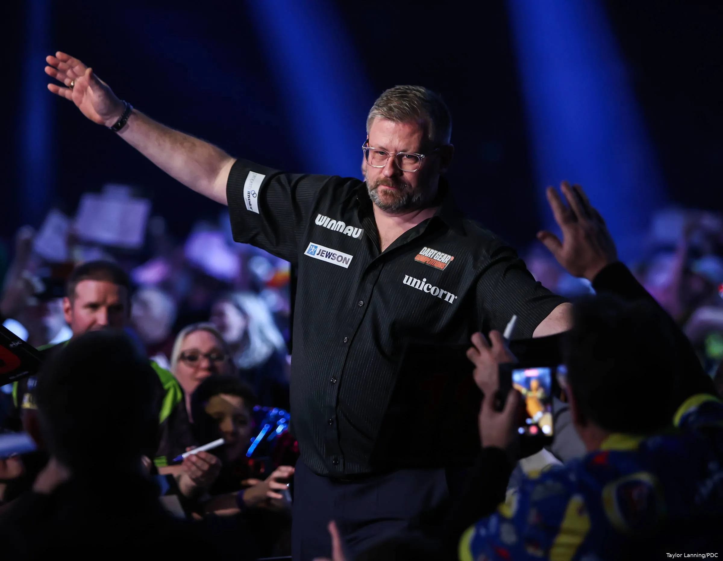James Wade waves to crowd.