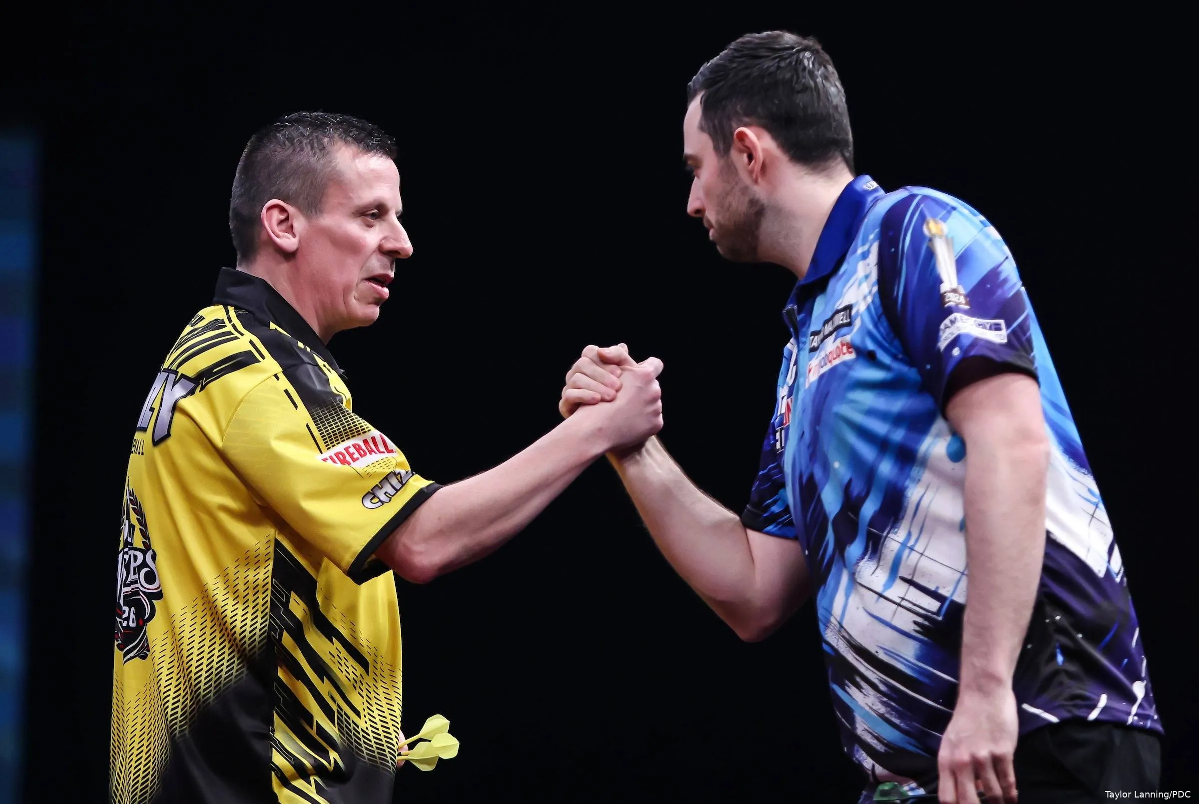 Dave Chisnall and Luke Humphries embrace before their Winmau World Masters match
