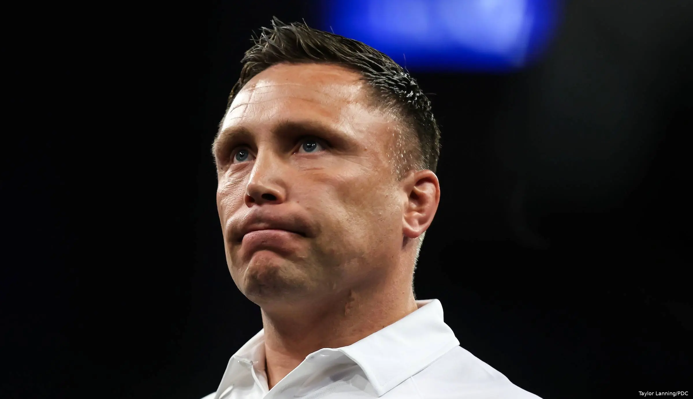 Gerwyn Price struggles on stage.