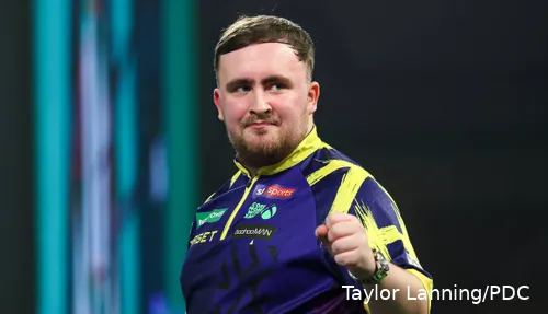 Luke Littler pumps his fist on stage