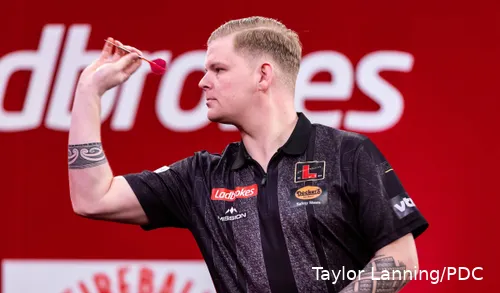 Mike De Decker sets to throw his dart