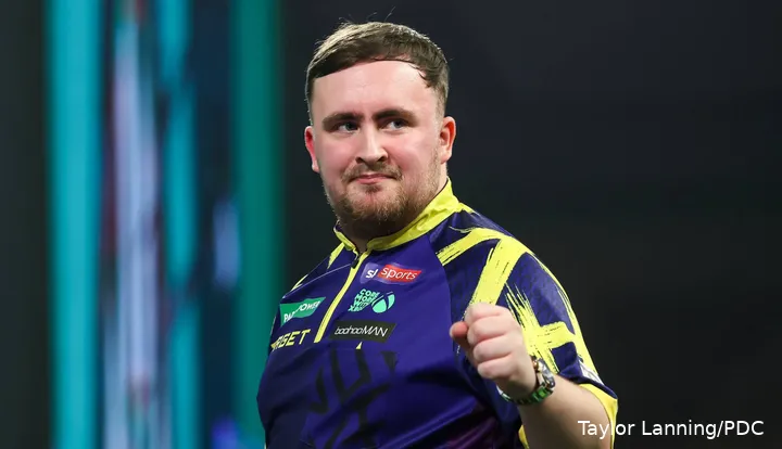 Luke Littler pumps his fist on stage