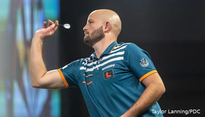 Thibault Tricole holding his dart in hand