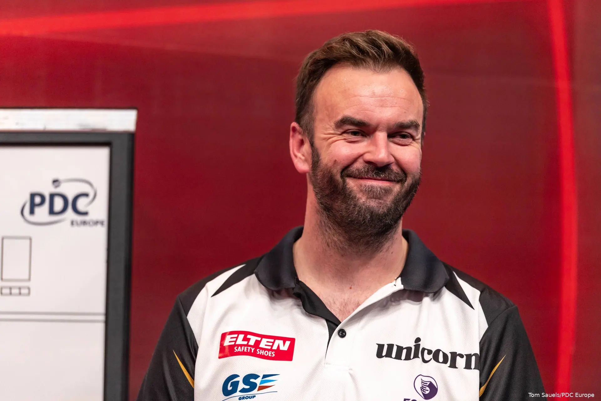 Ross Smith smiling on stage